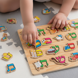 Child playing with Aleph-Bet Puzzle