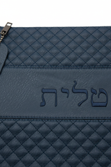 Close-up detail of embossed Hebrew text