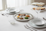 Close-up of Seder plate on elegant dining table