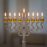 Menorah lit with olive oil cups