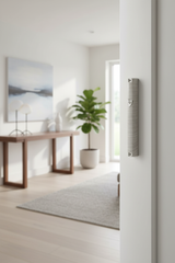Mezuzah on white doorframe