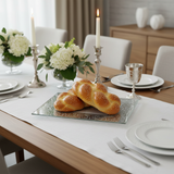 Shabbat table with elegant glass challah tray