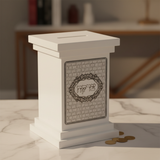 White tzedakah box on marble surface