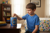 Boy putting coin in Tzedakah box