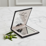 Premium tefilin mirror compact on marble surface with elegant lighting