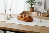 Shabbat challah board modern table setting