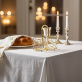 Shabbat table setting with gold cup holder